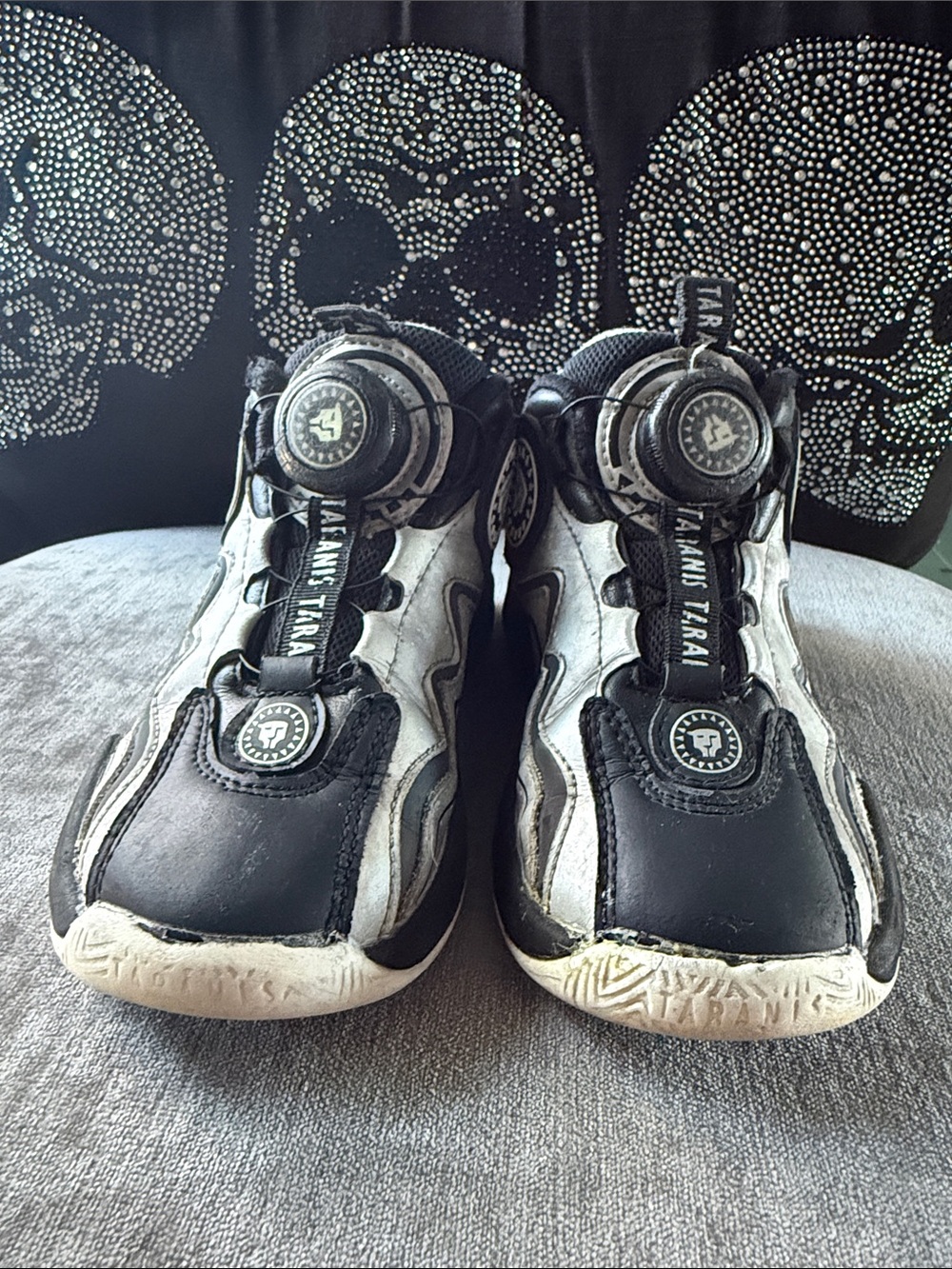 Black and White Kids' Sneaker with Unique Dial Closure
